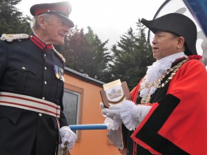 Mayor of Hounslow, Councillor Bishnu Gurung, presents Paul Kennerley DL with a plaque marking his retirement as Rep DL for Hounslow.