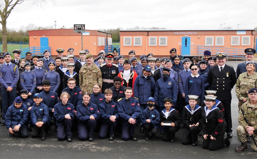 A group picture of uniformed youth organisations from Hounslow on parade at Cranford Community College.